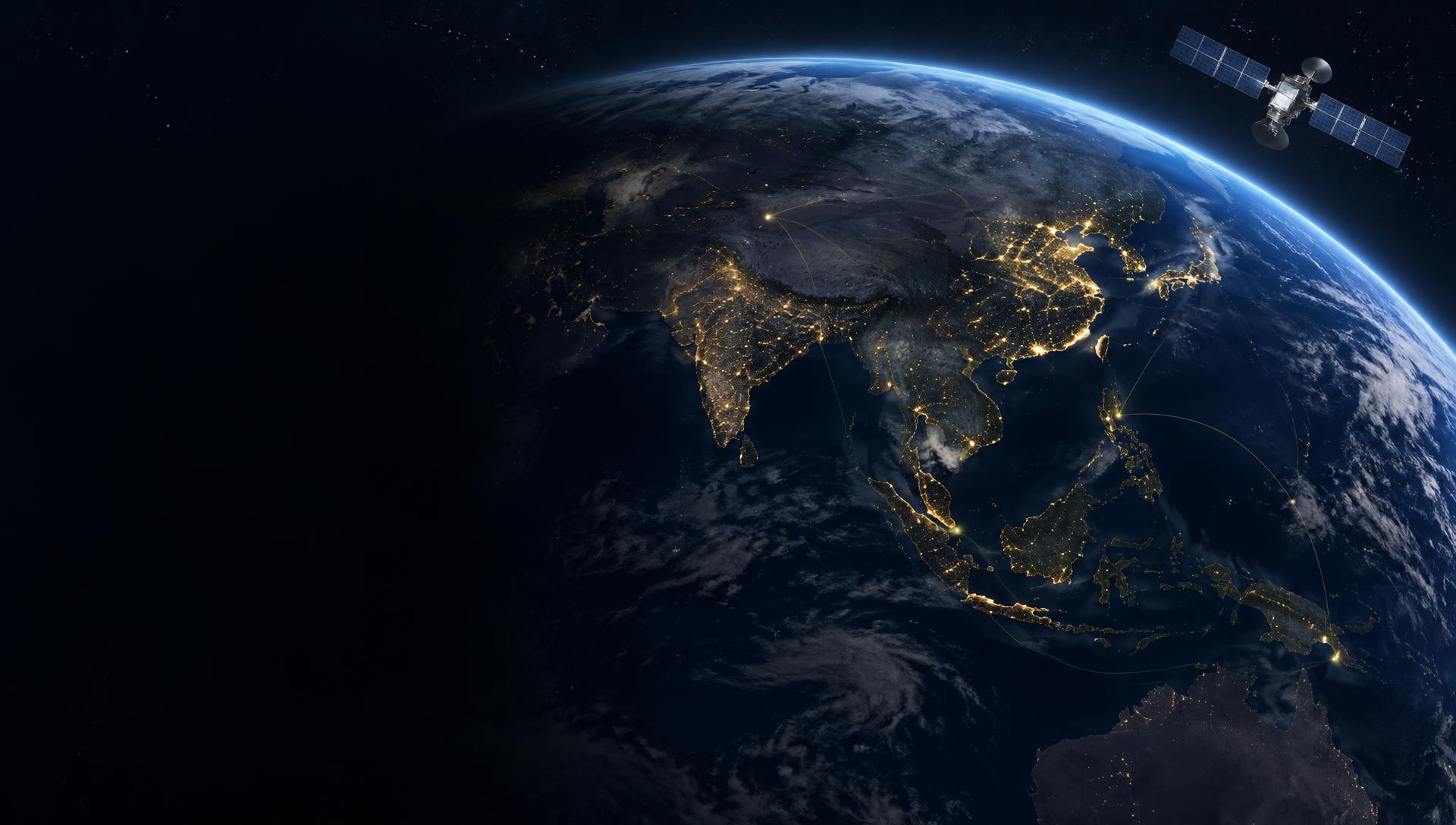 Satellite above the illuminated Earth, with Asia and Southeast Asia visible